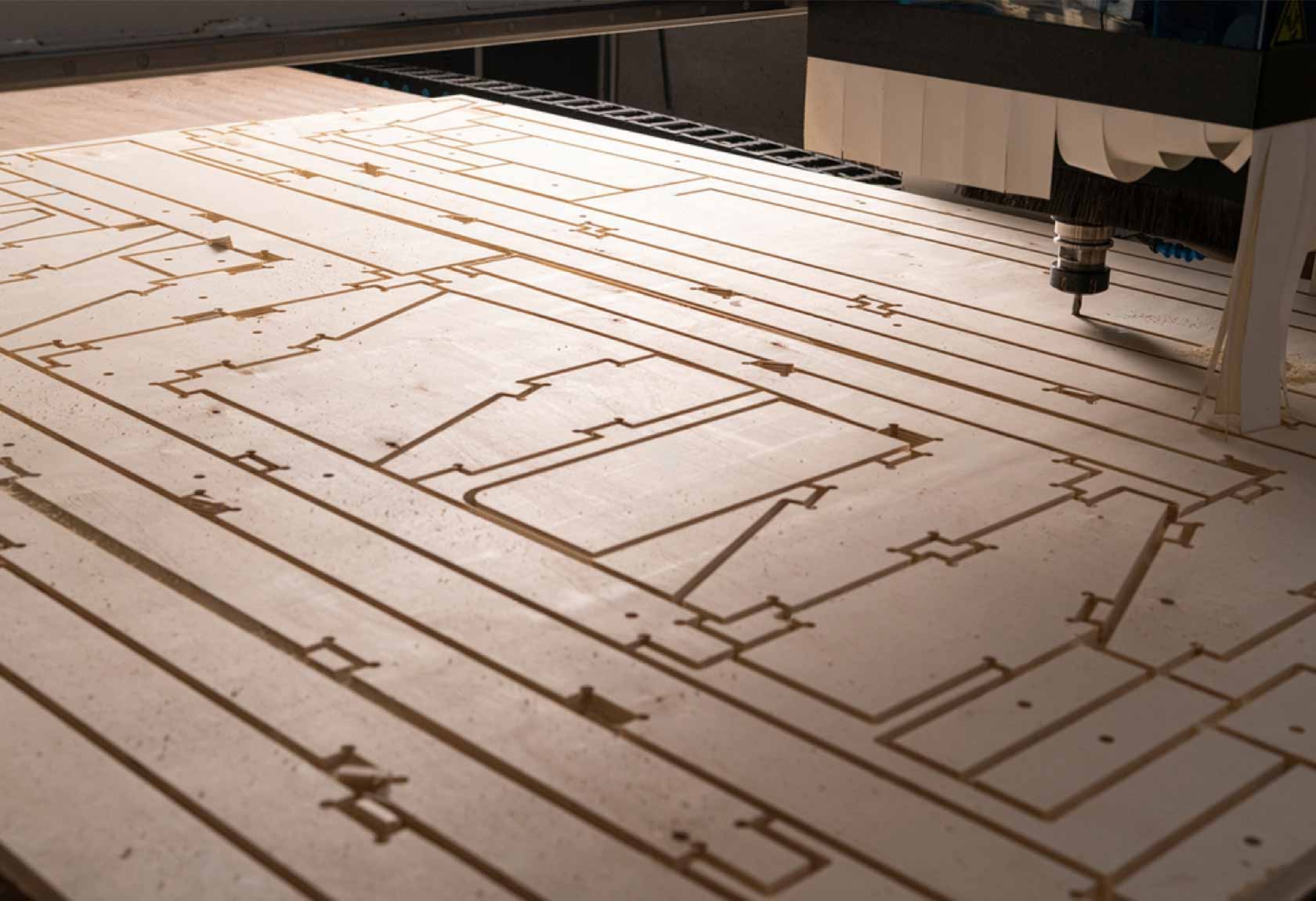 CNC router cutting wood in a workshop